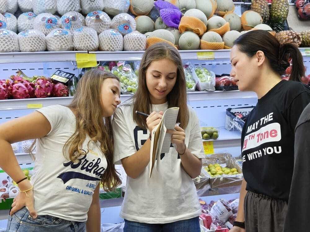 Children participating in interactive Chinese learning games