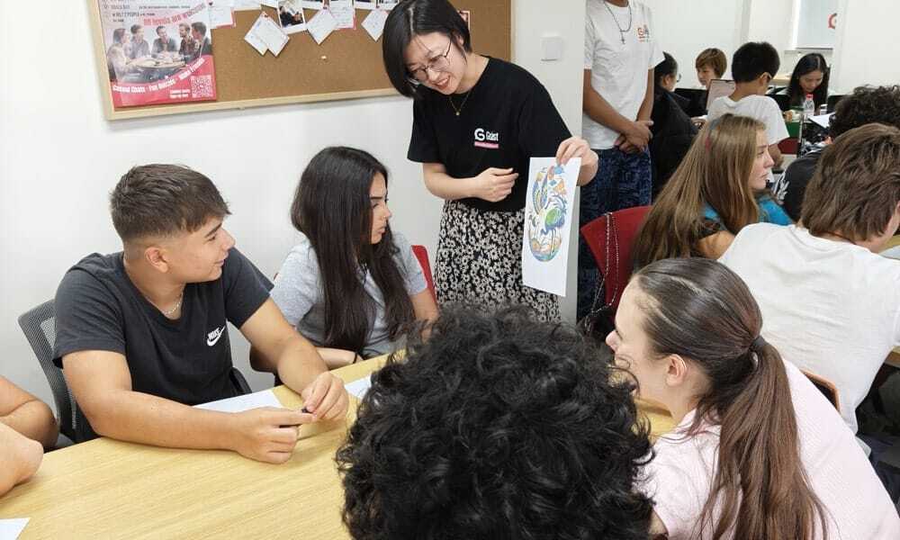 Professional teacher helping student with Chinese learning